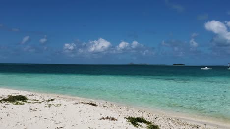 Motorboat-and-tent-on-white-sand-beach-caribbean-island-Los-Roques