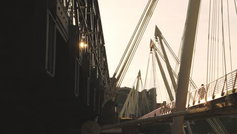 Golden-Jubilee-Bridges-and-Hungerford-Bridge-in-Beautiful-Golden-Evening-Sunset-Sun-Light,-a-Bridge-in-Central-London-Across-the-River-Thames,-England,-UK