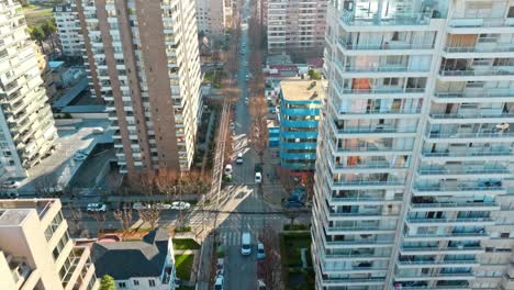 Bird's-eye-dolly-in-view-of-a-one-way-street-in-a-residential-neighborhood-in-ViÃ±a-del-Mar,-Chile