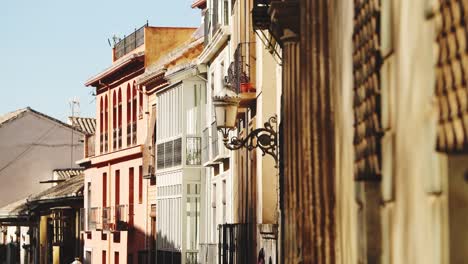 Architectural-detail-of-lamp-post-and-lights-on-a-narrow-side-street-in-Granada,-Andalusia-,-Spain,-Europe,-a-Popular-Tourist-Destination