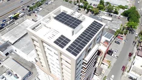 Drone-shot-capturing-solar-panels-on-high-residential-building,-renewable-energy-concept