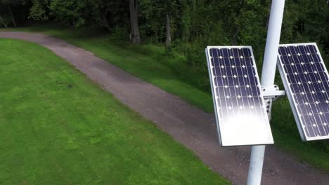 Solar-panel-energy-source-mounted-on-outdoor-public-lighting-pole