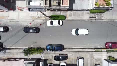 Shot-of-drone-descending-on-busy-streets