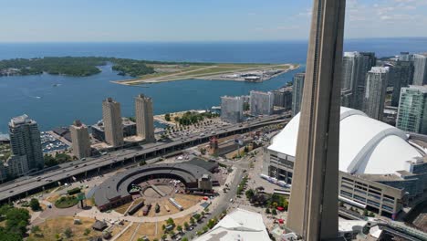 Drone-shot-of-CN-Tower-with-Toronto-Island,-Billy-Bishop-and-Gardiner-expressway-in-downtown-Toronto