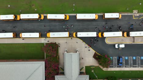 Students-exit-school-building-to-bus