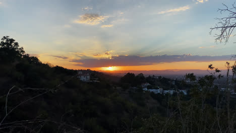 Hiking-Trail-View-Of-The-Sun-Setting-Behind-Mountains-Against-Blue-Sky-With-Clouds-In-Los-Angeles,-California-1