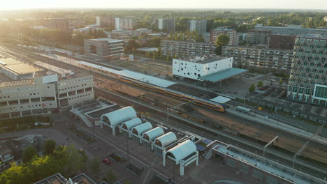 Aerial-View-Of-NS-Intercity-arriving-in-Gouda-Station,-Netherlands