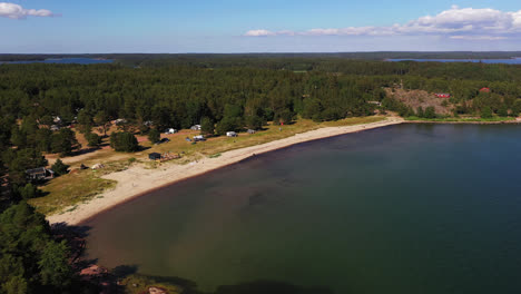 Aerial-view-around-the-Degersand-beach,-sunny,-summer-day-in-Aland,-Finland---circling,-drone-shot