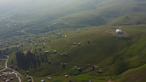 View-From-Drone-At-Sloping-Hills-Settled-By-Summer-Villages-In-Mountainous-Adjara,-Georgia