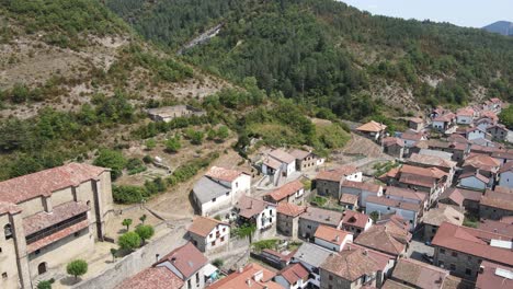 Aerial-view-from-drone-flying-forward-over-the-town-of-Garde,-Spain