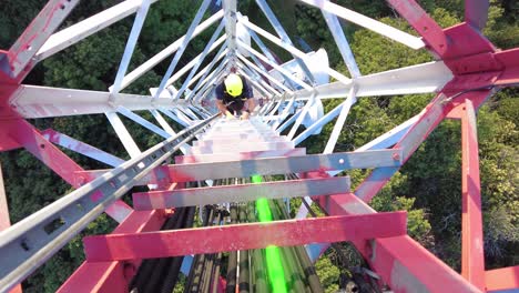 Technician-going-down-after-fixing-a-broken-cable-on-a-radio-tower---3D-render