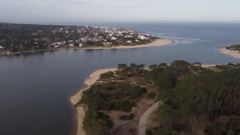 Aerial-wide-shot-of-Arroyo-Maldonado-River-Mouth-and-Ocean-during-cloudy-day-in-Uruguay