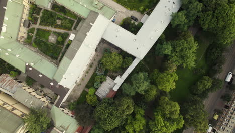 Aerial-top-down-shot-of-Saint-Peter-and-Paul-Church-in-Krakow-surrounded-by-trees