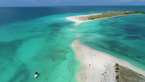 Paradise-tropical-island-cayo-de-agua,-aerial-view-landscape-from-white-sand-isthmus