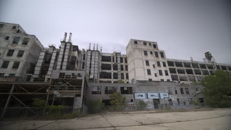 Low-angle-4k-drone-view-of-abandoned-manufacturing-plant-in-Detroit-4