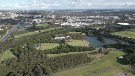 View-Bicentennial-park-from-above,-aerial-flight-over-the-40-scenic-hectares-parklands-in-Sydney