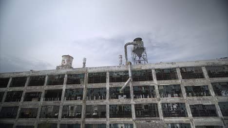 Low-angle-4k-drone-view-of-abandoned-manufacturing-plant-in-Detroit