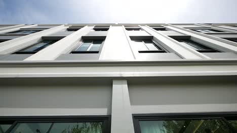 Modern-White-Building-Exterior-Design,-low-angle,-No-People