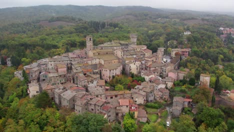 Old-medieval-historic-town-of-San-Casciano-dei-Bagni-in-Tuscany,-aerial