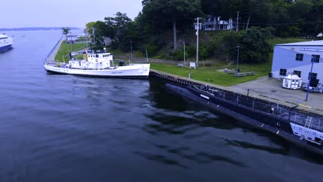 A-few-boats-docked-in-the-channel-between-Muskegon-Lake-and-Lake-Michigan-in-day-for-night