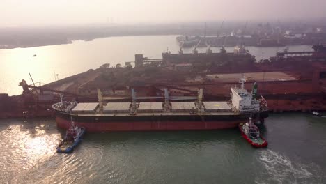 Aerial-View-Of-Bulk-Carrier-Unloading-Coal-At-Paradip-Port-In-Orissa,-India---drone-shot