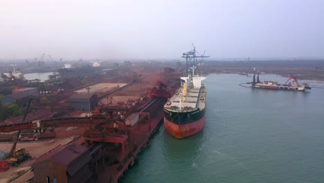 Bulk-Carrier-Cargo-Ship-At-Paradip-Port,-Odisha,-India---aerial-drone-shot