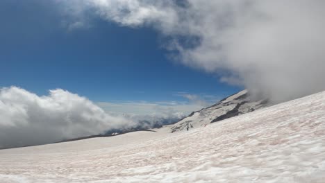 View-of-clouds-passing-over-Mount-Rainier,-taken-on-the-side-of-the-mountain