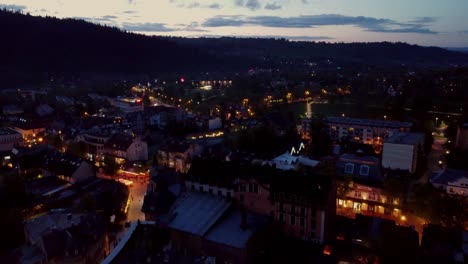 Evening-flyover-of-Zakopane,-Poland,-a-resort-town-against-the-Tatra-Mountains,-and-its-stunning-Goral-traditional-architecture-3