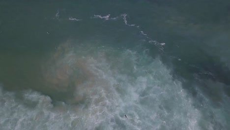 Top-down-view-of-paradise-and-beautiful-green-ocean-in-Cascais-surf-spot