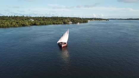 Sail-ship-sailing-in-Mida-Creek,-natural-wonder-of-Mangrove-ecosystem-in-Watamu,-Kenya