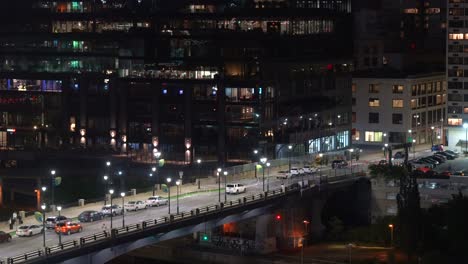 Traffic-on-an-elevated-road-in-the-small-city-of-Philadelphia,-Pennsylvania-from-a-high-angle-at-night