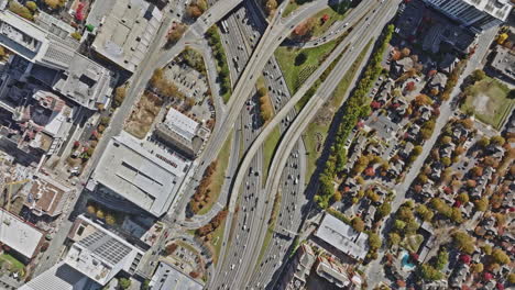 Atlanta-Aerial-v758-cinematic-vertical-shot-drone-flyover-downtown-area-capturing-metropolitan-cityscape,-urban-park-and-busy-freeway-traffics-at-daytime---Shot-with-Mavic-3-Cine---November-2021