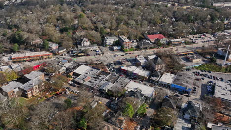 Atlanta-Aerial-v783-cinematic-birds-eye-view-flyover-moreland-avenue-at-little-five-points-neighborhood,-tilt-up-reveals-downtown-cityscape-at-daytime---Shot-with-Mavic-3-Cine---December-2021