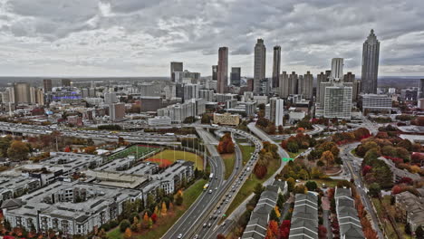 Atlanta-Aerial-v755-cinematic-pull-out-shot-capturing-skyscrapers-in-central-district-and-low-rise-buildings-in-surrounding-neighborhoods-during-autumn-season---Shot-with-Mavic-3-Cine---November-2021
