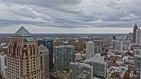 Atlanta-Aerial-v752-drone-fly-through-in-between-high-rise-buildings-at-midtown-commercial-district-capturing-downtown-cityscape-during-daytime-with-cloudy-sky---Shot-with-Mavic-3-Cine---November-2021