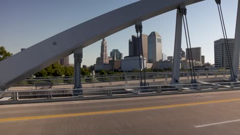 Columbus,-Ohio-skyline-and-Main-Street-Bridge-with-gimbal-video-wide-shot-walking-sideways