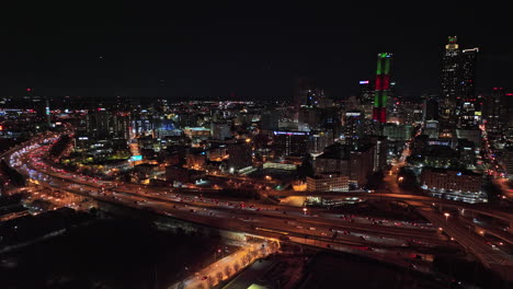Atlanta-Aerial-v786-cinematic-drone-flyover-sweet-auburn-neighborhood-capturing-freeway-traffic-light-trails-and-illuminated-downtown-cityscape-at-night---Shot-with-Mavic-3-Cine---December-2021