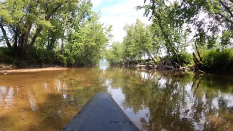 A-canopy-shaded-water-channel-leading-into-Lovewell-Pond-in-Fryeburg,-Maine