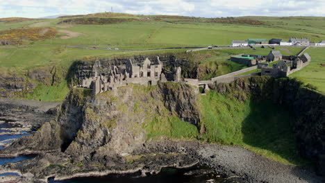 Fantastic-aerial-shot-over-Dunluce-castle-in-Ireland,-the-setting-for-the-Game-of-Thrones-series