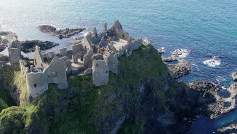 Fantastic-aerial-shot-over-Dunluce-castle-in-Ireland,-the-setting-for-the-Game-of-Thrones-series-1