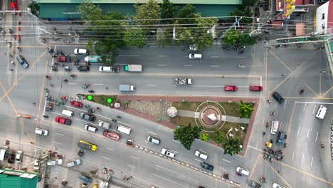 Top-down-view-of-triangle-intersection,-busy-traffic-highway