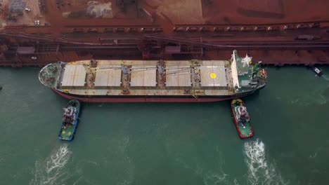 Bulk-Carrier-In-Port-Waiting-To-Unload-Cargo-At-Paradip-Port-In-Odisha,-India---aerial-drone-shot