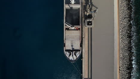 Aerial-shot-over-one-of-the-ships-that-transport-the-merchandise-and-the-cranes-that-load-the-cement