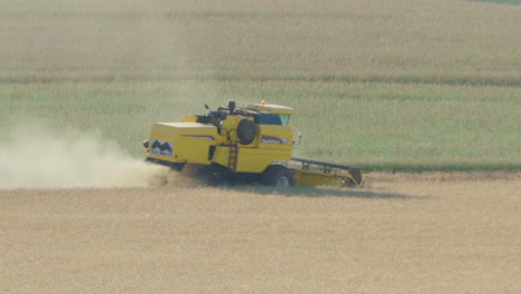 Wide-shot-of-a-seeder-tractor-harvesting-soybeans-in-the-country