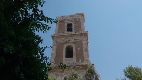 Hand-held-Shot-Of-The-Bell-Tower-Of-Santa-Chiara-Church,-Napoli,-Italy