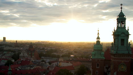 Scenic-Sunrise-Over-Krakow-City-Center-In-Poland---aerial-drone-shot