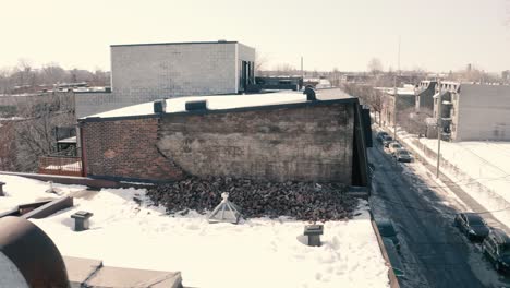 Broken,-fallen-brick-wall-on-roof