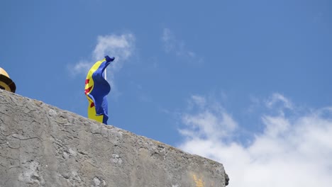 Flag-of-Madeira-waving-on-top-of-stone