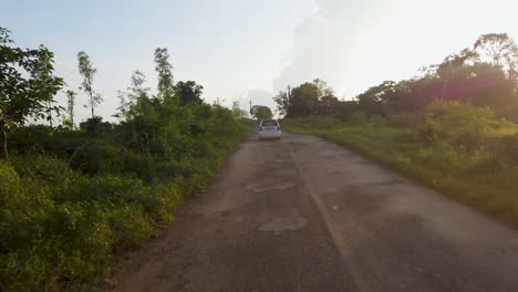 Following-White-Car-Driving-On-The-Road-In-Trimbakeshwar,-Nashik,-India