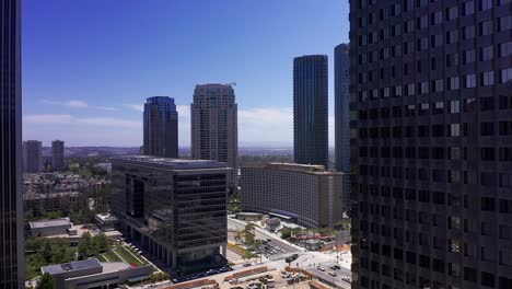 Aerial-dolly-shot-around-skyscraper-to-reveal-Century-City,-California